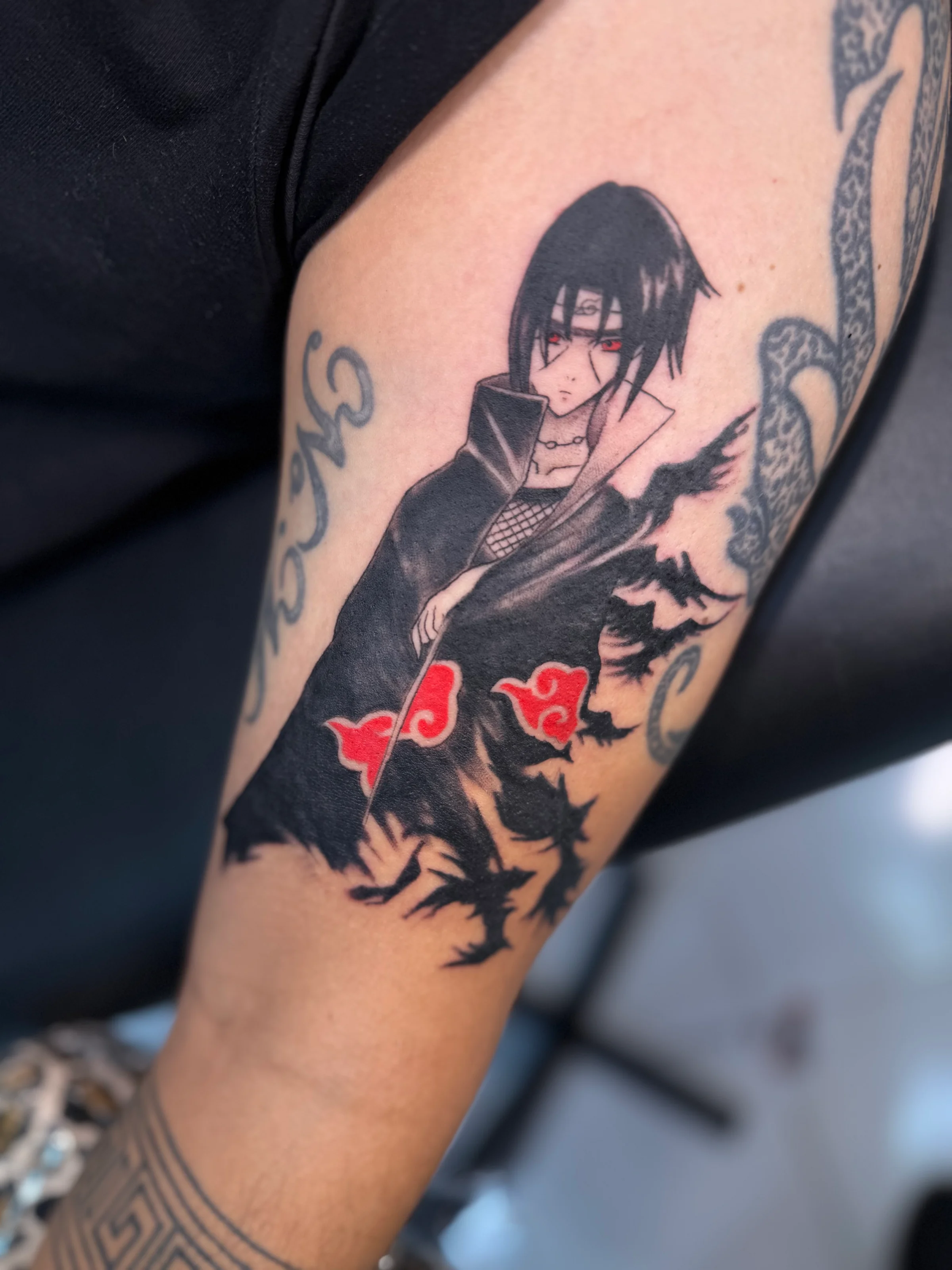 Tatouage Sasuke noir et blanc